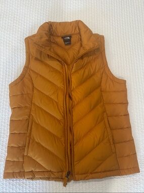 The North Face Quilted Down Puffer Vest in Mustard Yellow